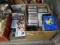 DVDs, VHS, cassette tapes and large assortment of CDs. Contents of 2 boxes.