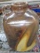 Brown crock jug with light swirl