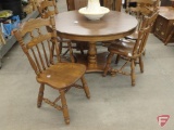 Wood 47in round table with (4) leaves, and (6) matching chairs.