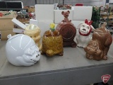 Cookie jars, McCoy turtle, dog with bow, and brown dog, plastic Porky Pig, and ceramic pig and mouse