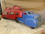 Vintage metal truck with car hauler and two cars