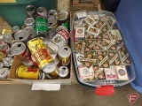 Playing cards, collection of cans, can banks, and Jack Daniels mugs.