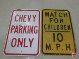 Metal signs, Chevy Parking Only and Watch for Children. Both