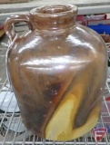 Brown crock jug with light swirl