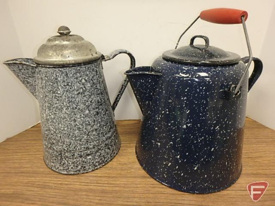 Enamelware coffee pots, one is black and white, one is navy and white