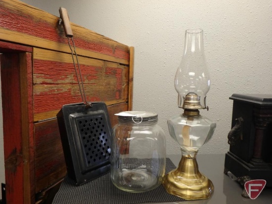Vintage kerosene lamp, popcorn popper, and glass jar