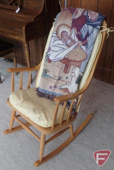 Wood rocking chair with cushions and Christmas throw