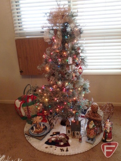 Christmas tree, lights, old stockings, decorative Santas, tree skirt