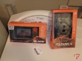 Wild Game Cloak Twelve Pro Lights Out trail camera with handheld SD card viewer; both