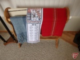 Quilt rack with Scandinavian table cloths, western themed table runners and blanket