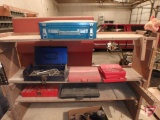Assorted sockets, hex wrenches, empty tool cases, drill bits and work bench