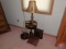 Round occasional table, lamp, small curio, and wood shelves