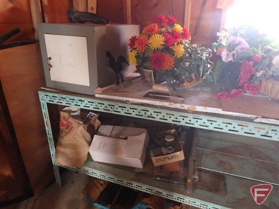 Contents of green shelf: fan, artificial flowers, dishes, locking cabinet, metal pieces, homemade