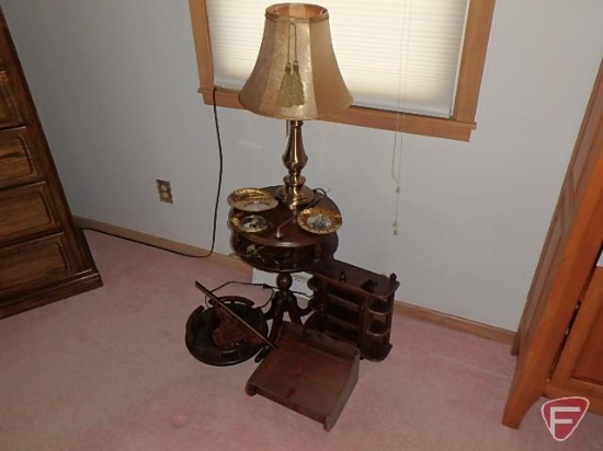 Round occasional table, lamp, small curio, and wood shelves