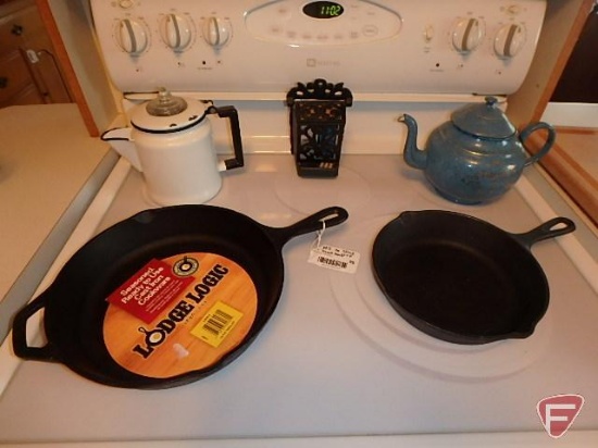 Enamel coffee pots, Lodge Logic cast iron fry pans, and match holder