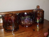 Carnival glass canisters, one piece missing top
