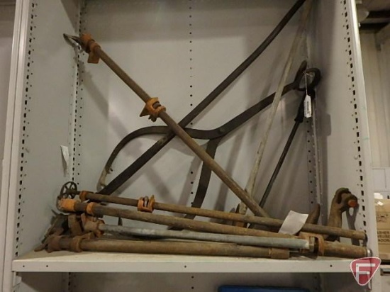 Ice tongs, pipe clamps, pry bar, hook, and ax; contents of shelf