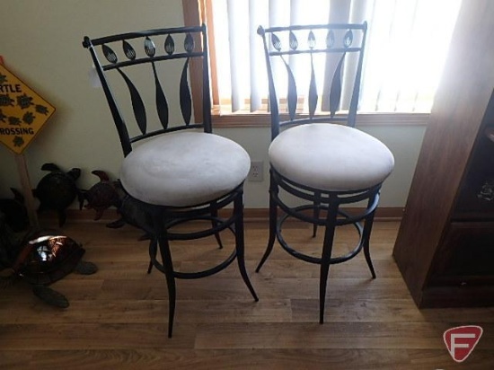 Pair of bar stools, black metal leaf design with tan cushion