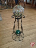 Gazing ball stand with glass ornament and green glass ball paperweight