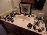 Turtles by sink and in drawers, lawn decorations, orange glass one