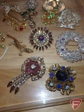 Jewelry, broaches and pins