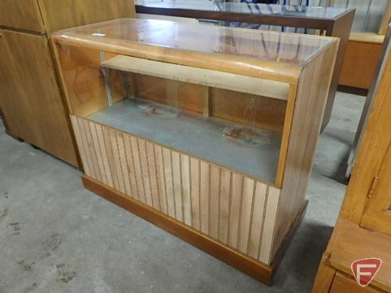 Wood/glass display case with one wood shelf, back has 2 doors for display are and 2 doors for