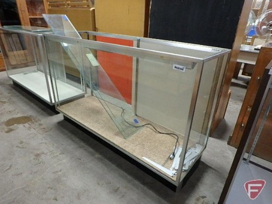 Glass lighted display case, sliding doors, glass adjustable shelving, top glass is missing,