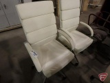 (2) white leather-like office chairs on rollers