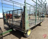 Steel 9x16 throw rack with wood floor on John Deere 10-ton running gear