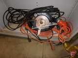 Black & Decker circular saw, Black & Decker drill, and extension cords