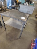 Metal work table with under shelf and welding clamp holder