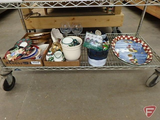 Christmas dishes, spreaders, wine glasses, metal bucket with ornaments, cream and sugar