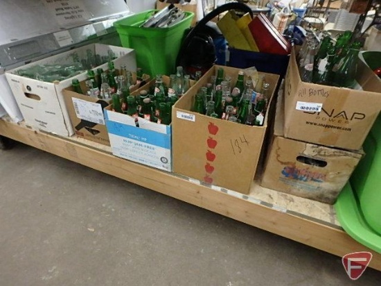 Assortment of pop bottles, Pepsi-Cola, Mountain Dew, Dr Pepper, 7Up, Coke. Contents of 6 boxes.