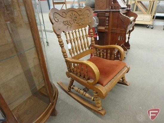 Oversized wood rocker with upholstered seat and nailhead trim, back is 27inW