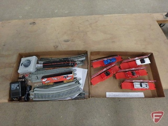E Z Track train tracks, controller, Corvette train, engine and train cars with toy cars.