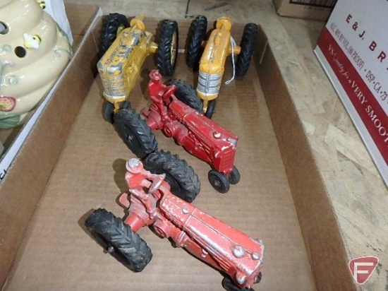 Minneapolis-Moline toy tractors, one has half a seat