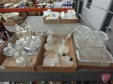 Clear glass condiment sets in metal holders and on glass trays, measuring cup, refrigerator dishes.