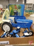 Ford tractors, wagon, plate from National Farm Toy Show, and puzzle