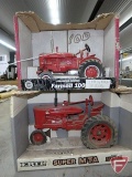 Farmall 100 tractor, no. 14192, Super MTA tractor, no. 445, soiled