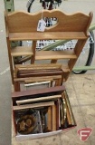Assortment of frames and wood wall shelf