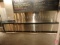 Custom stainless steel beer and wine dispensing station with stone countertop,