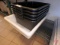 (5) black bus trays and (1) Choice 18x26x6 food storage container