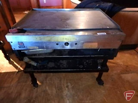 Wolf gas griddle on casters, 24"x36" griddle, 28-1/2"x36"x31"H with exhaust hood