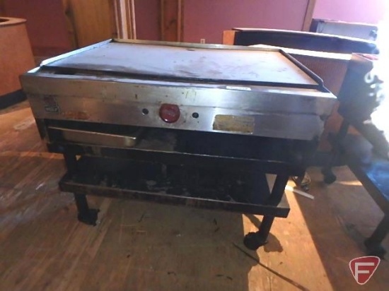 Wolf gas griddle on casters, 24"x36" griddle, 28-1/2"x36"x31"H with exhaust hood