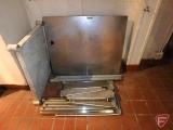 Stainless steel table with legs, stainless steel brackets, and full size baking pan