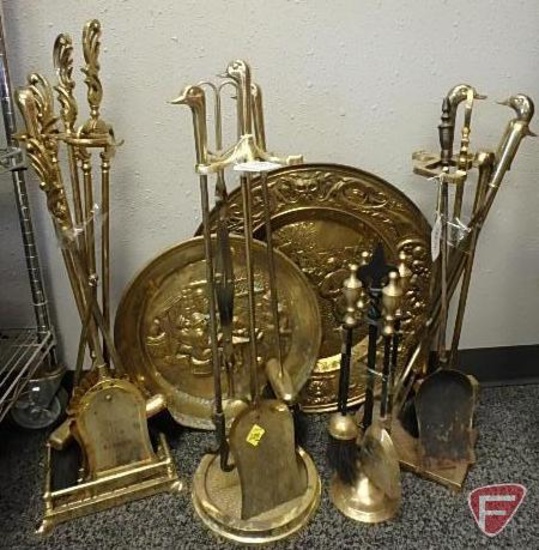 Brass fireplace pokers, brooms, shovels, tongs, and (2) platters with relief art