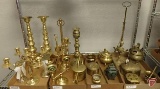 Brass candelabra and candle sticks, watering can, potpourri pots, pestle and mortar, incense burner