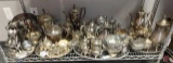 Silver plated and pewter tea pots, cream and sugars, trays and more, whole shelf