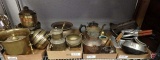 Brass pots, copper tea pot and watering can, aluminum krumkake irons and more, whole shelf