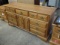 Wood dresser, 7 drawers, 2 door with 2 drawers behind, 35inHx68inWx19inD.